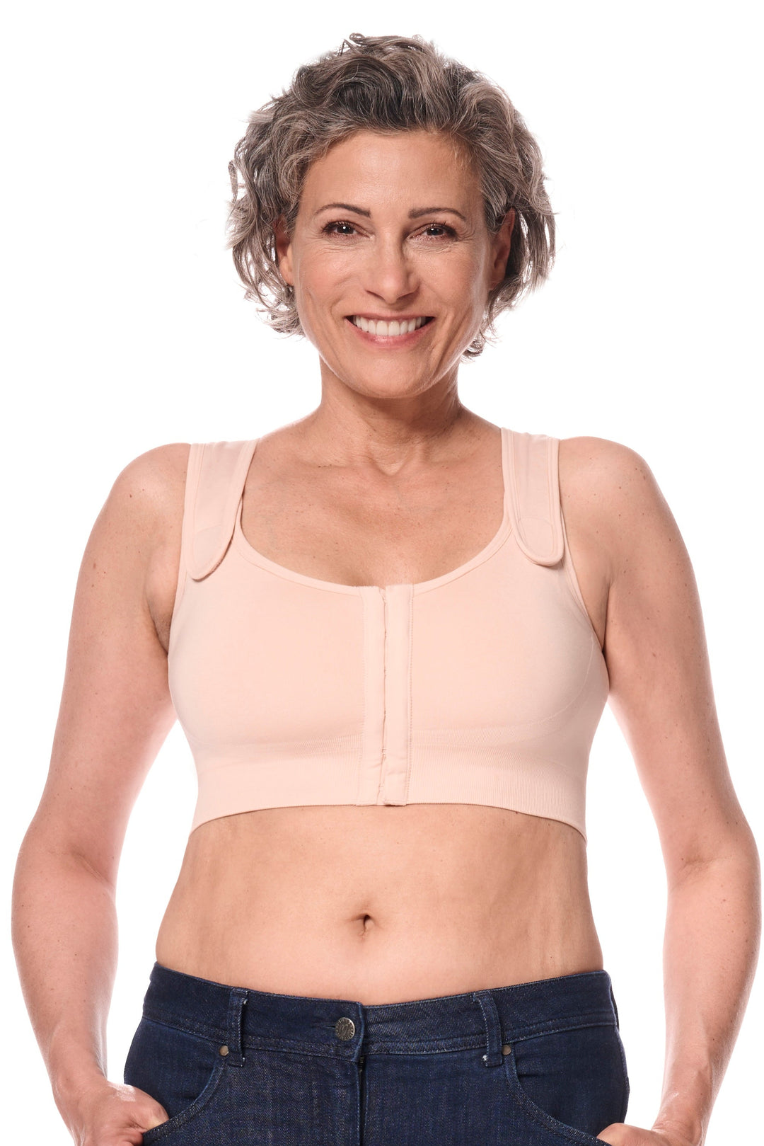Woman wearing a beige compression garment on a white background